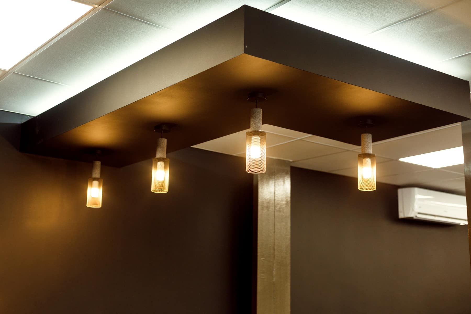 Warm feature lighting on a dark ceiling, installed by our team